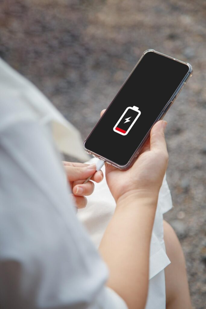 Close up woman hands charging her mobile phone with charging icon 35782 312